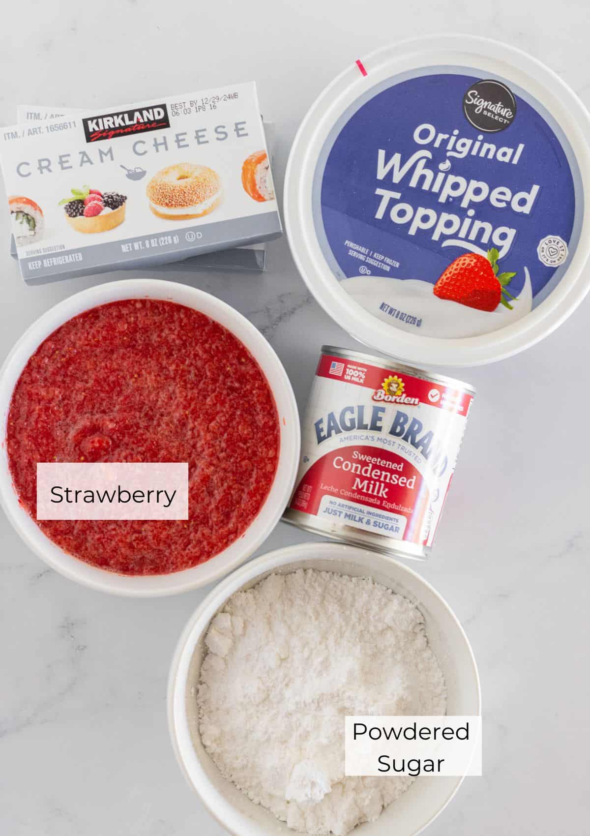 The ingredients needed to make no bake strawberry cheesecake.