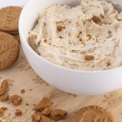 Biscoff buttercream in a bowl with cookie crumbs.