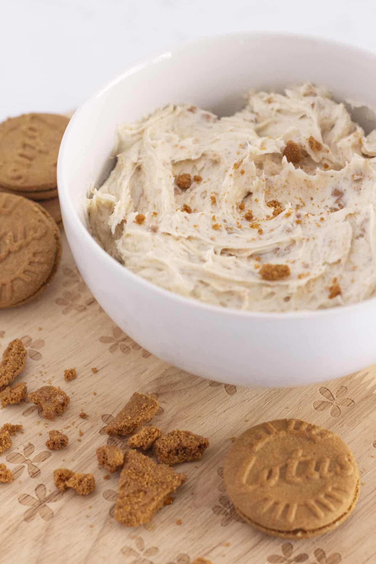 Biscoff buttercream in a bowl with cookie crumbs.