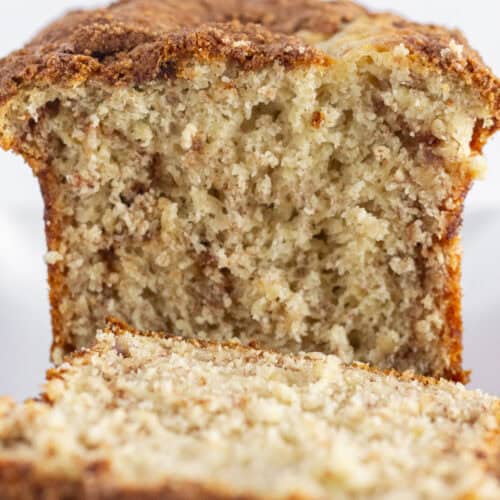 A loaf of cake mix banana bread with a cinnamon swirl baked inside.