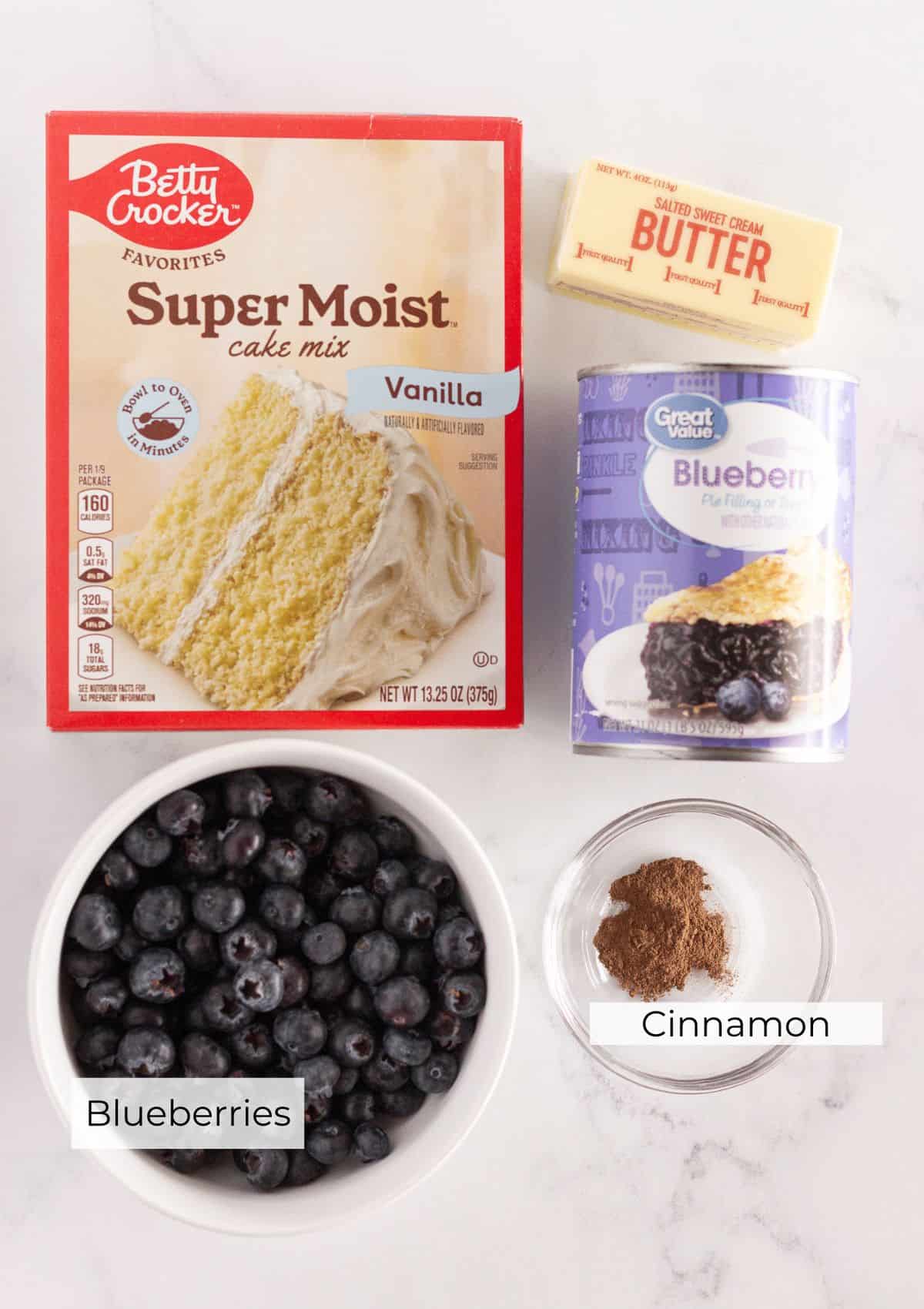 The ingredients needed to make a blueberry cobbler.