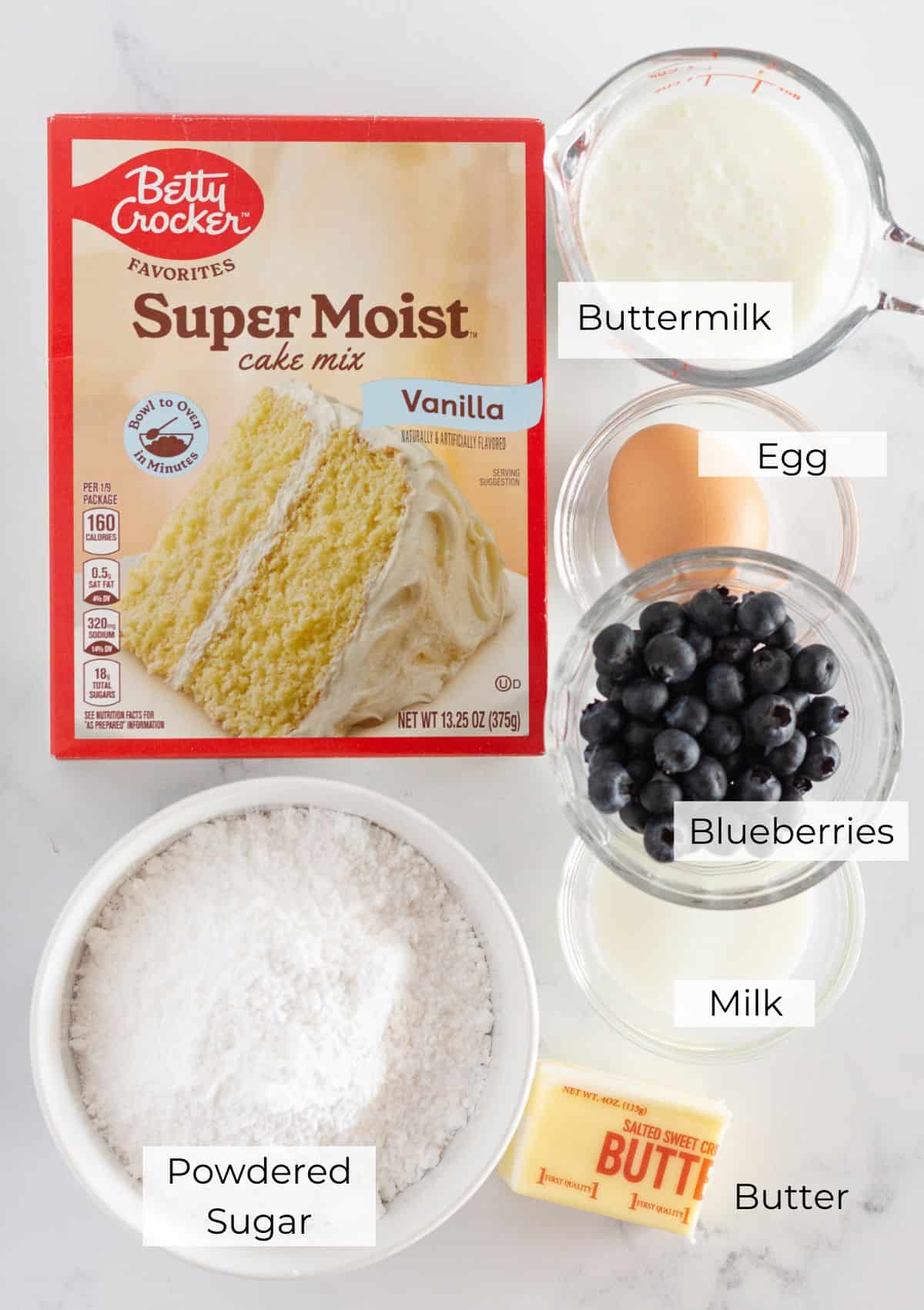 The ingredients needed to make blueberry cake donuts.