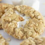 Rice krispie cookies on a white tray with large marshmallows.