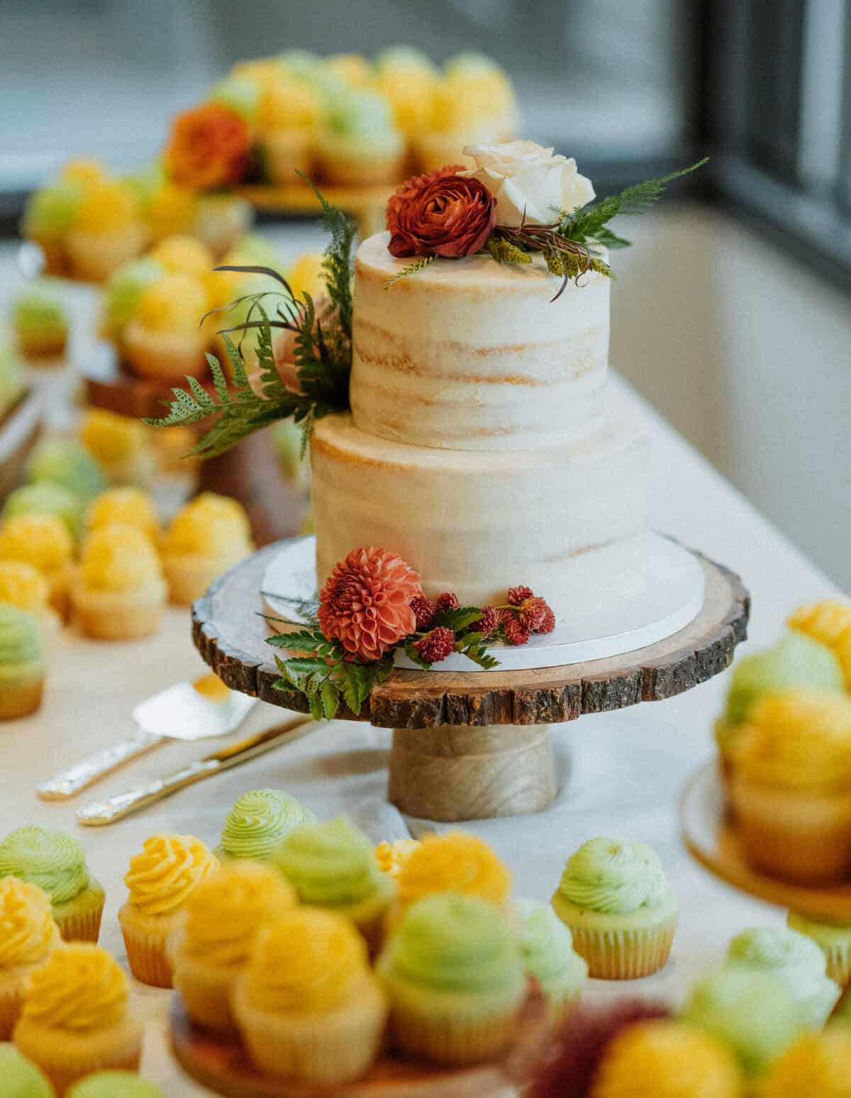 The wedding cake and cupcakes.