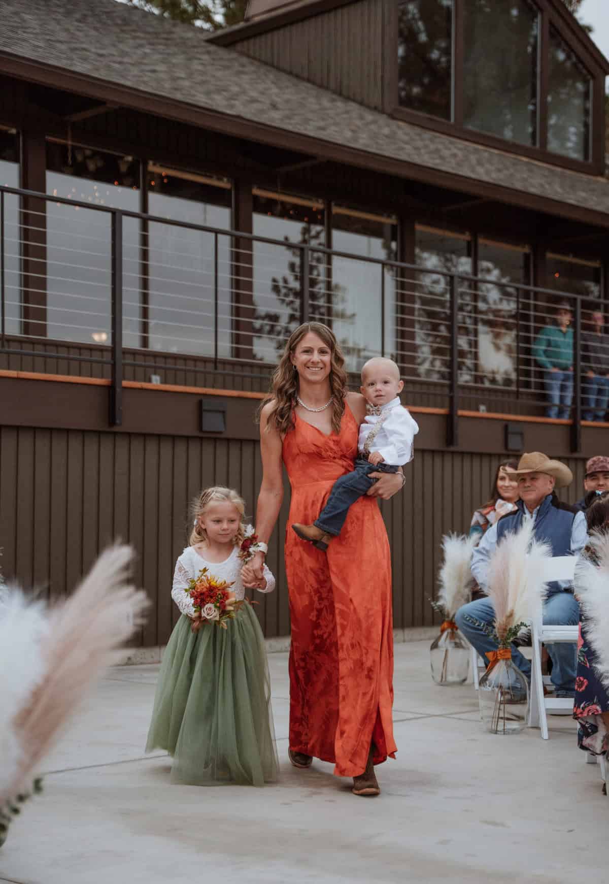 Flower girl and ring bearer coming down the aisle.