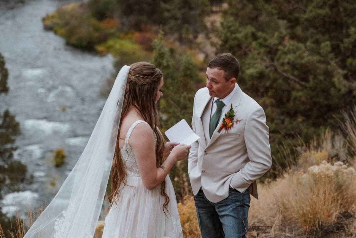 Private exchanging of vows overlooking the river.