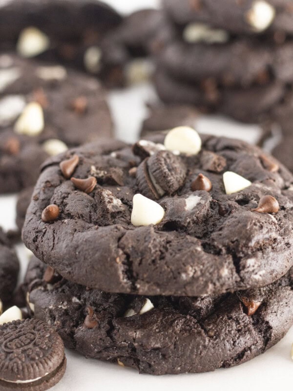 Stacks of chocolate cookies and cream cookies.