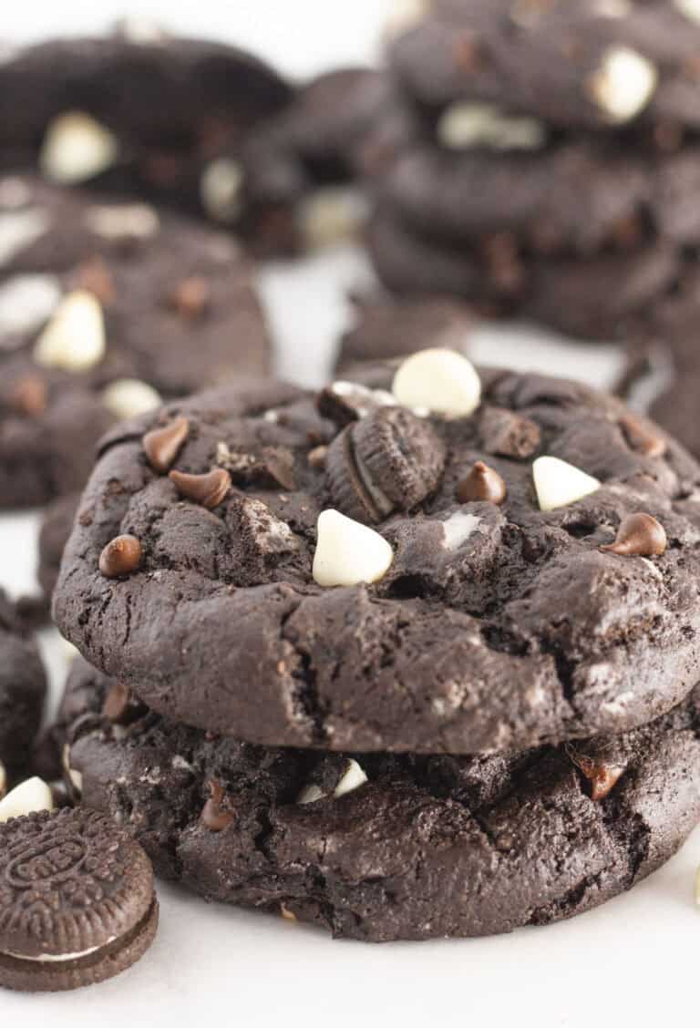 Stacks of chocolate cookies and cream cookies.