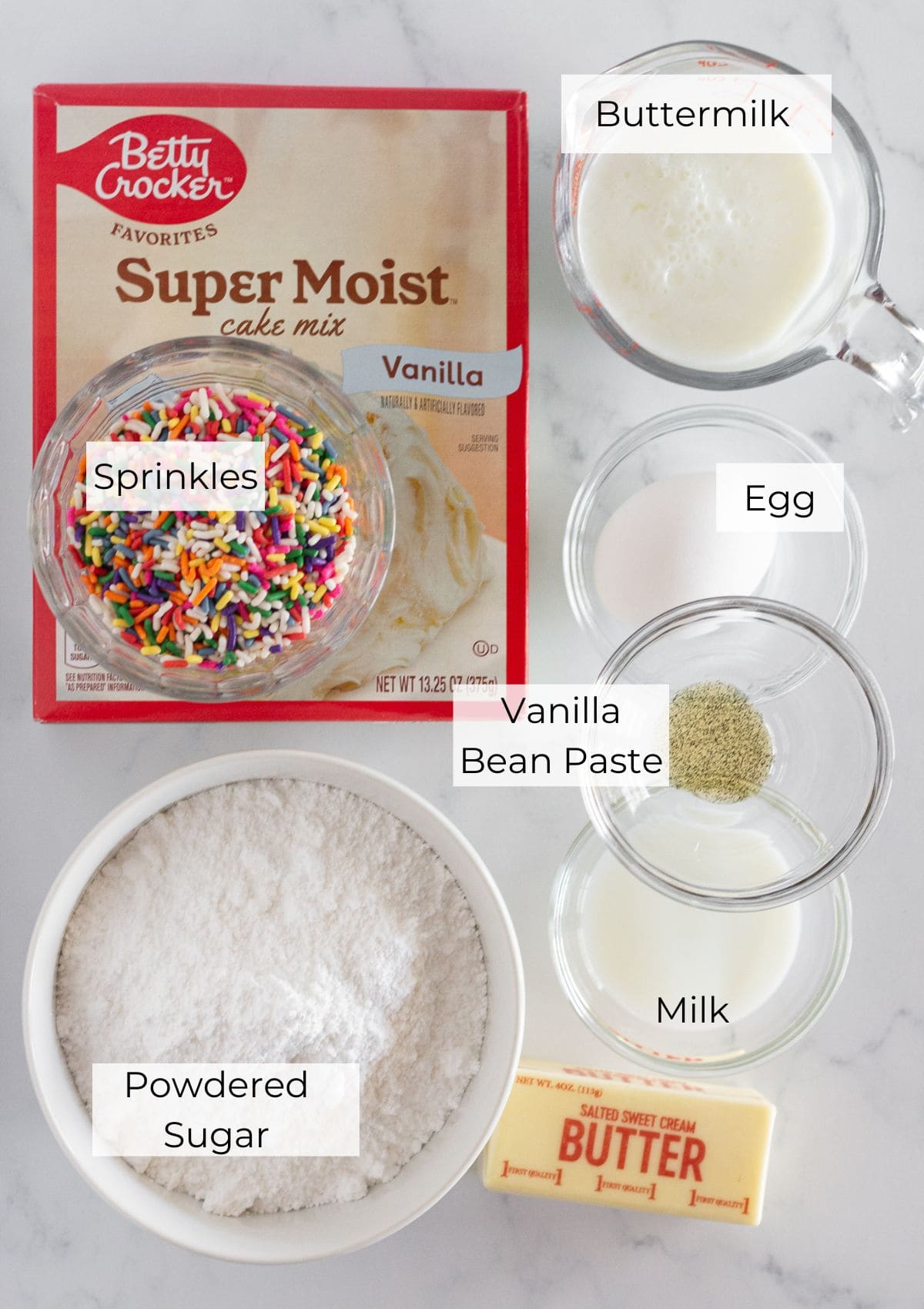 The ingredients needed to make funfetti donuts with a cake mix.