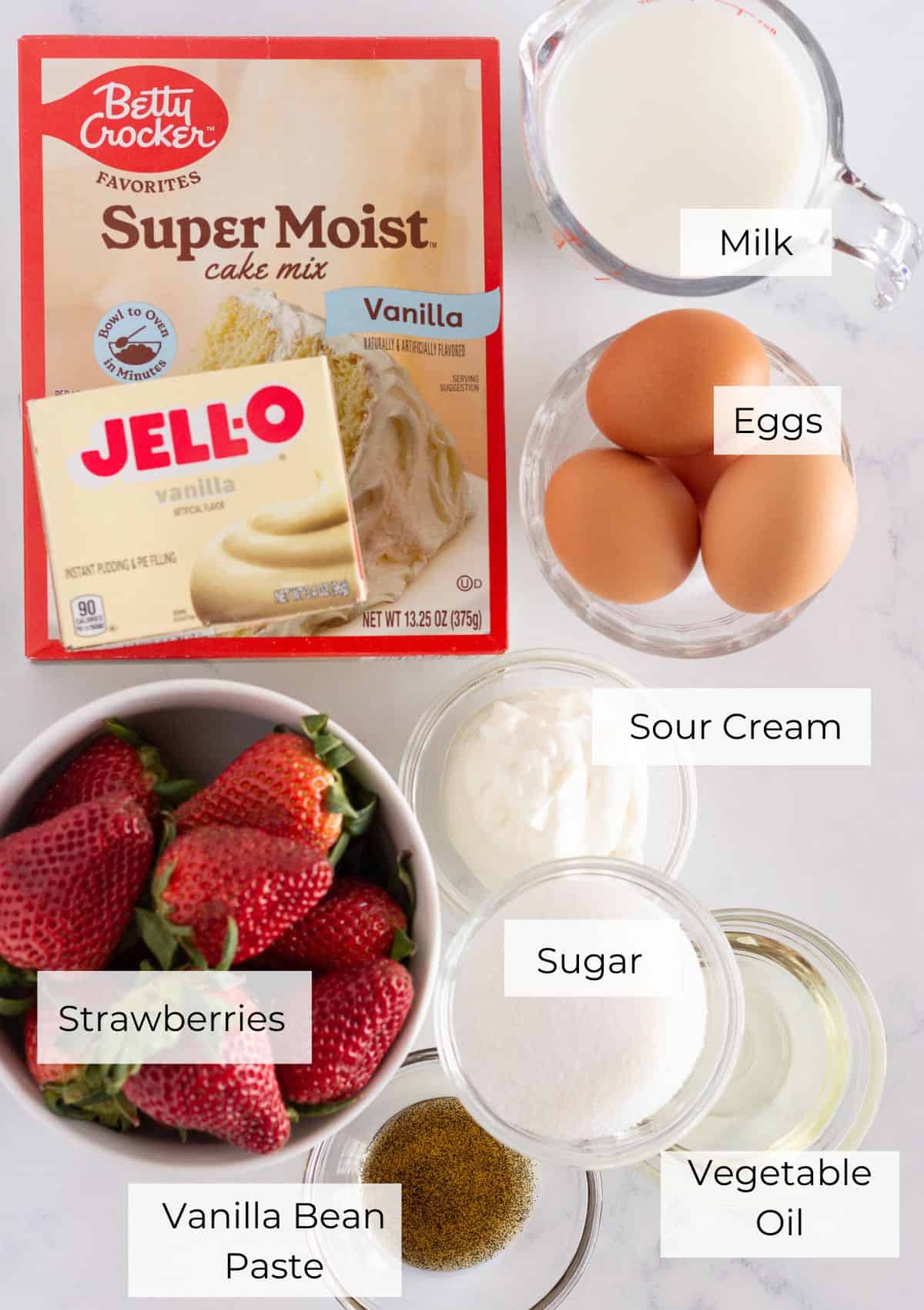 The ingredients needed to make mini strawberry shortcakes.