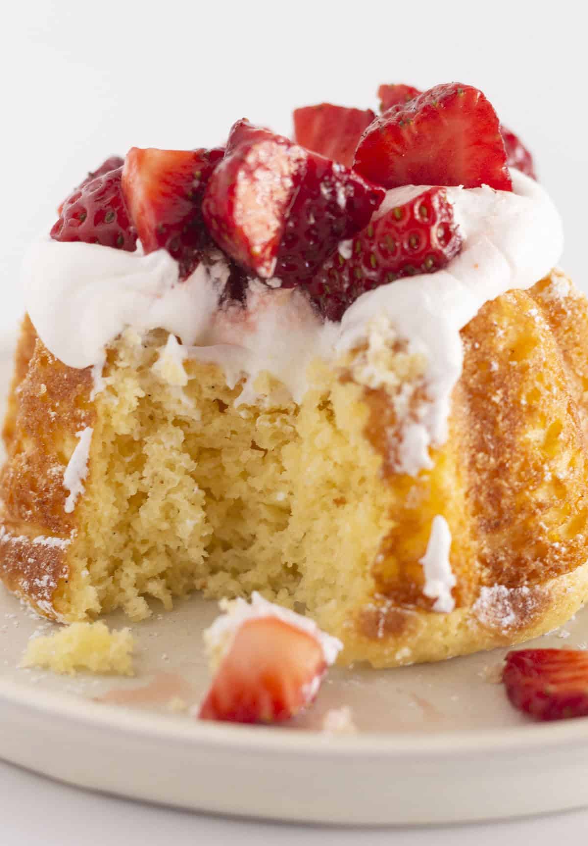 The inside of a mini strawberry shortcake after a bite has been taken.