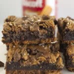 Biscoff Brownies stacked on each other with a cookie crust.