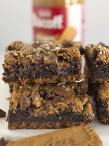 Biscoff Brownies stacked on each other with a cookie crust.