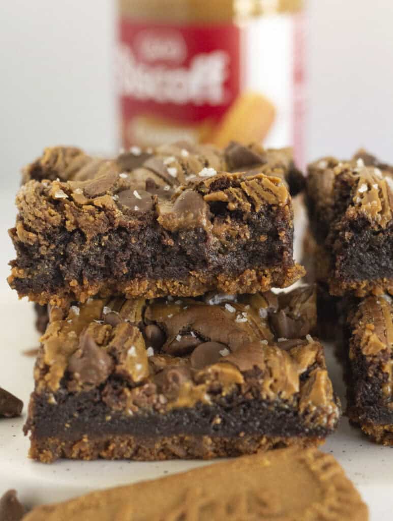 Biscoff Brownies stacked on each other with a cookie crust.