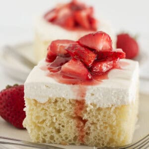 Two slices of vanilla sheet cake that starts with a cake mix.