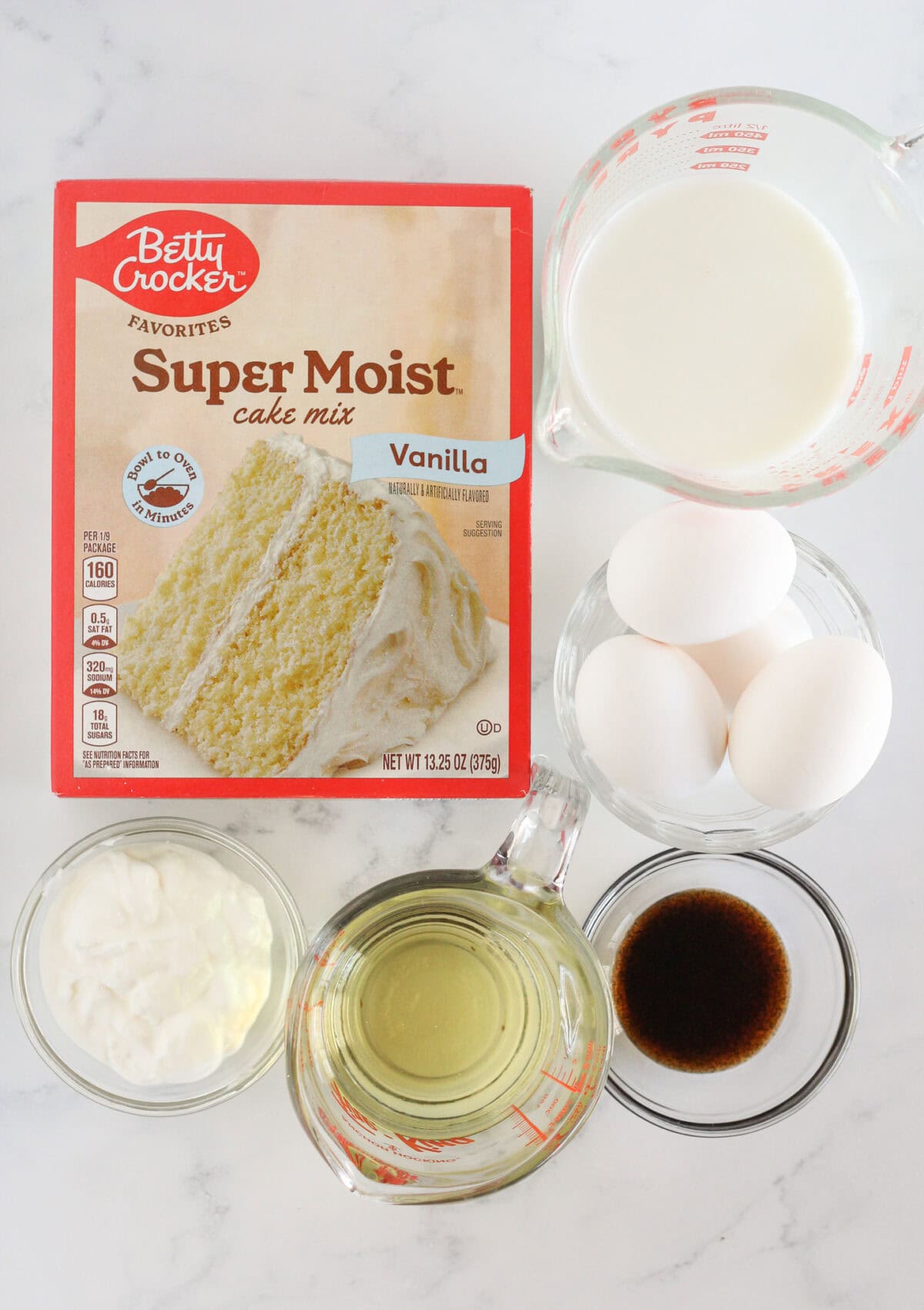 The ingredients needed to make vanilla sheet cake with a cake mix.