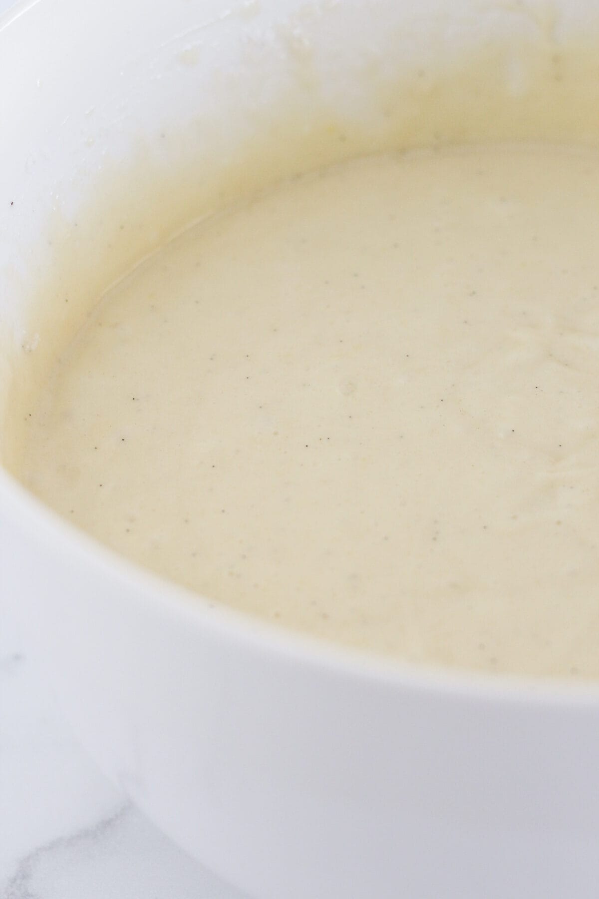 Making the vanilla sheet cake batter from a cake mix.