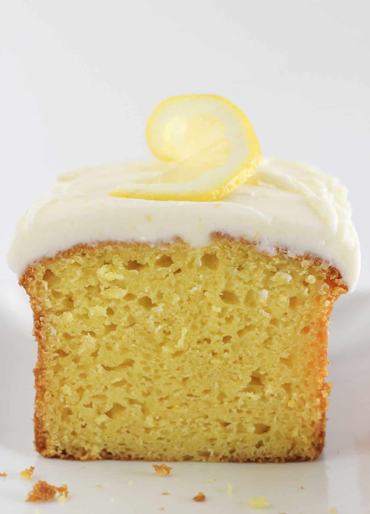 A loaf of lemon bread with frosting on top.