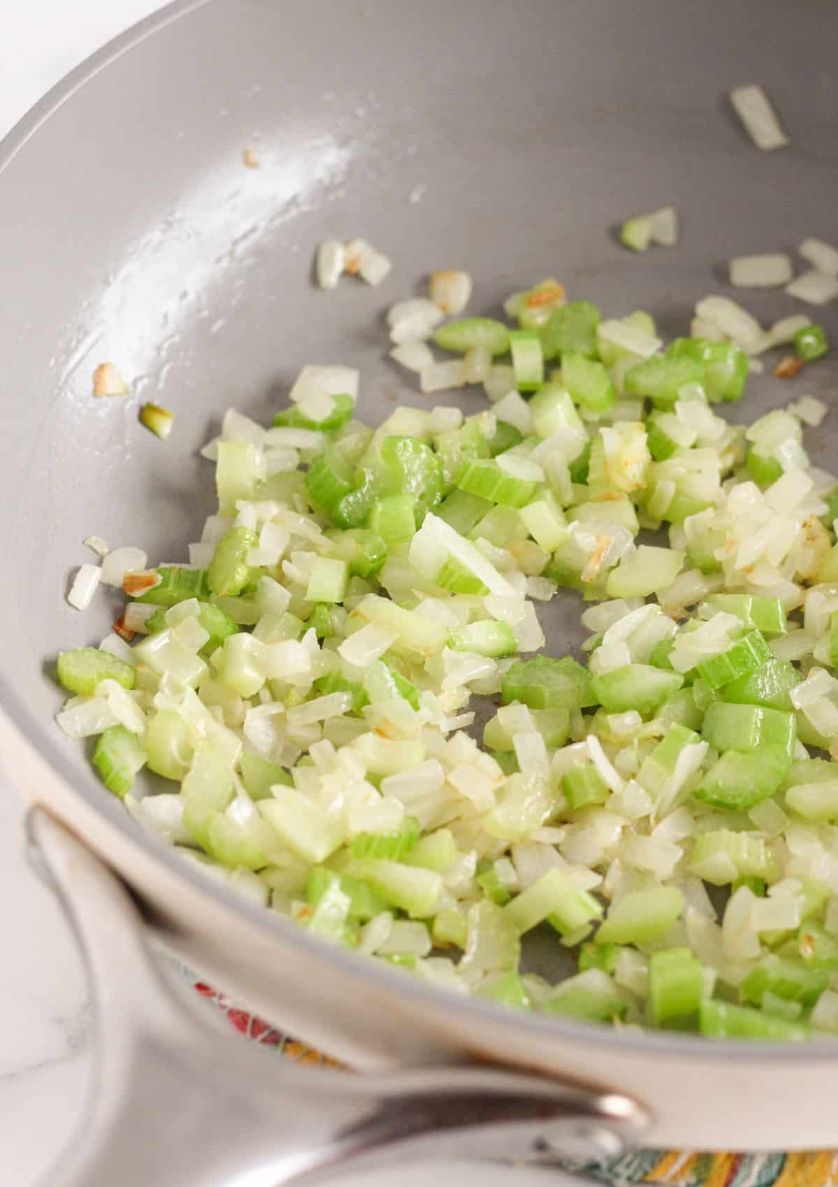Cooking onion and celery in butter.
