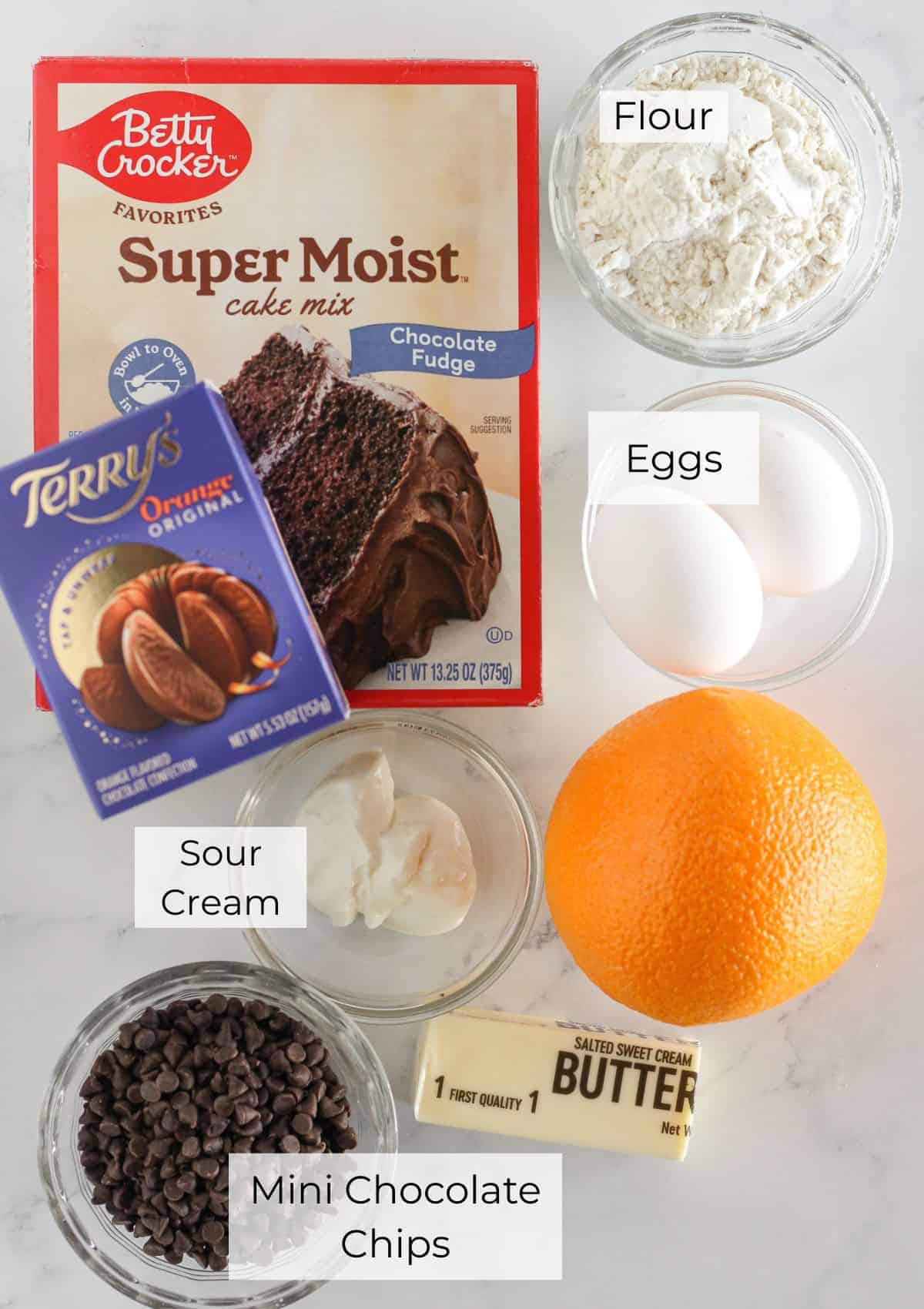 The ingredients needed to make chocolate orange cookies.