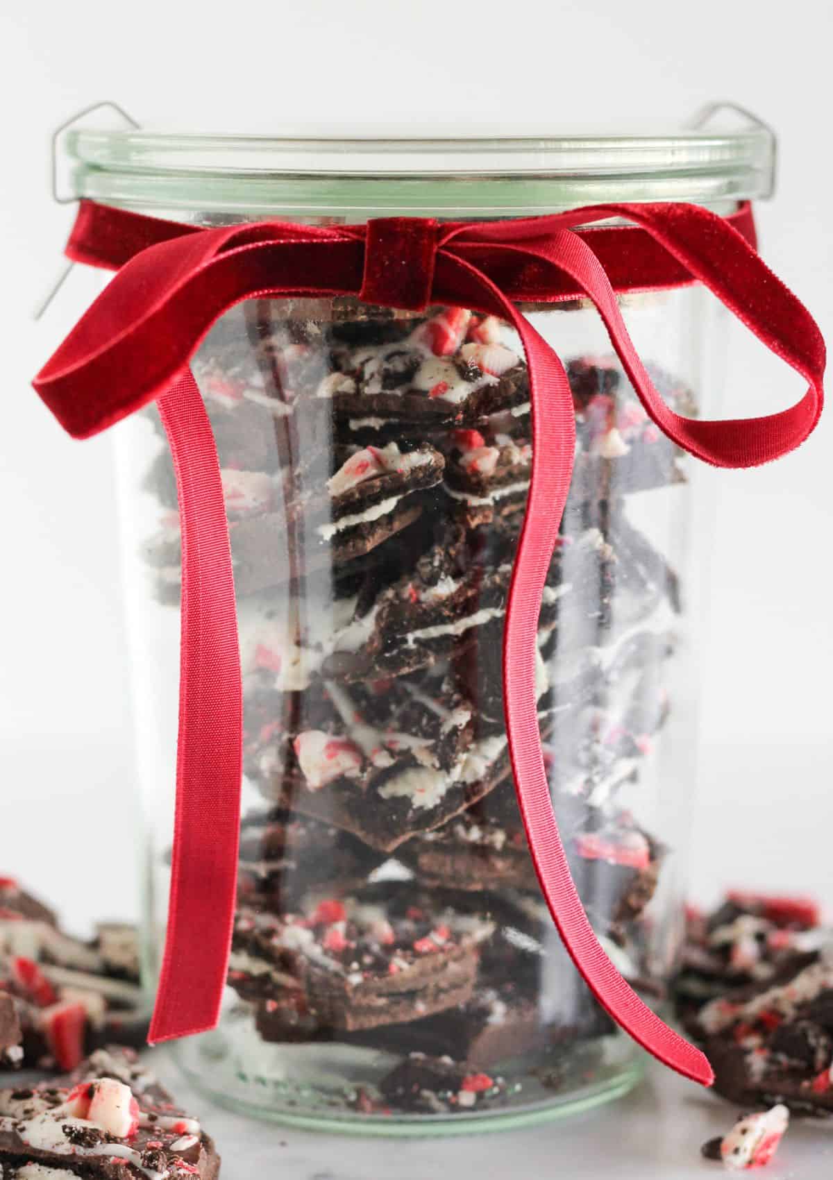 Gifting candy in a clear jar with ribbon.