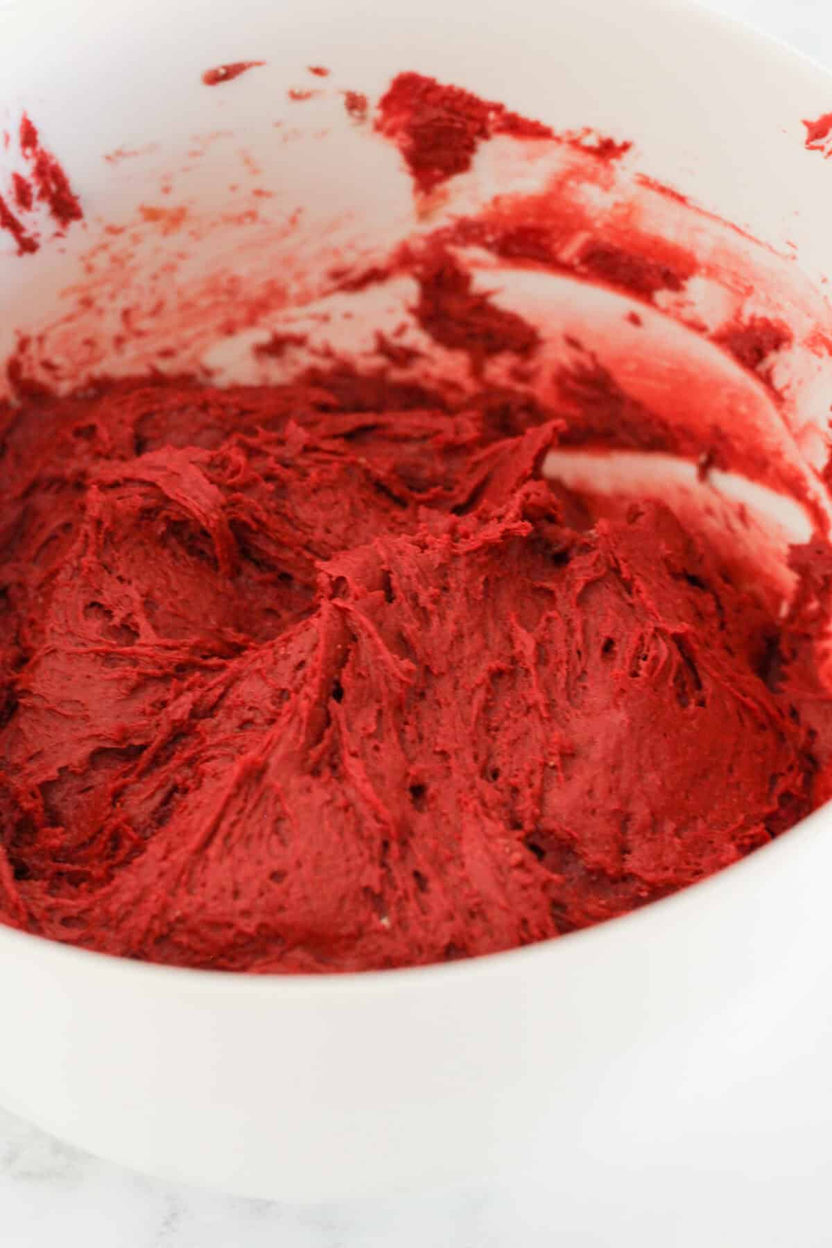 Red velvet cake mix cookie dough in a bowl
