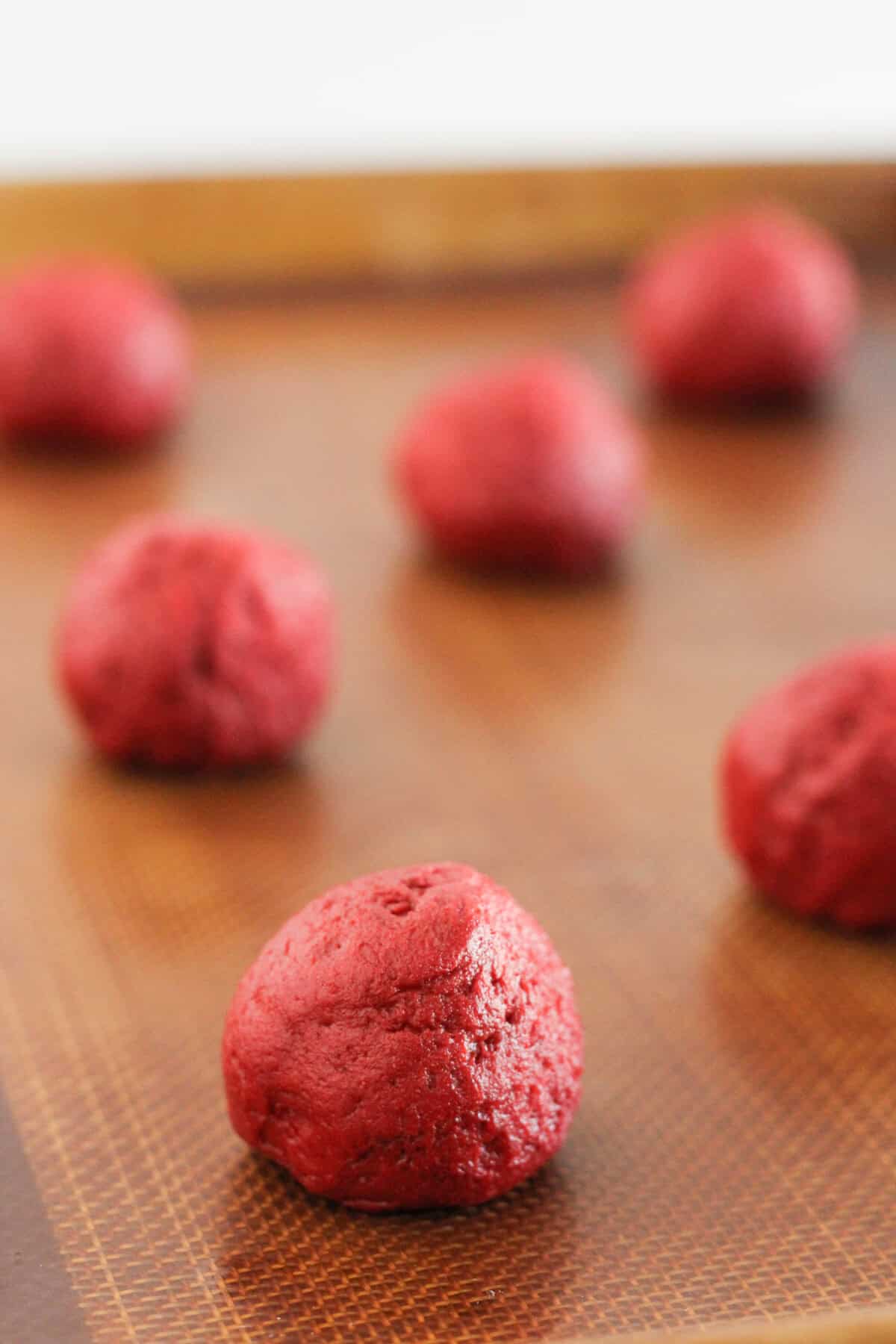 Red velvet cake mix cookie dough ready to be baked.