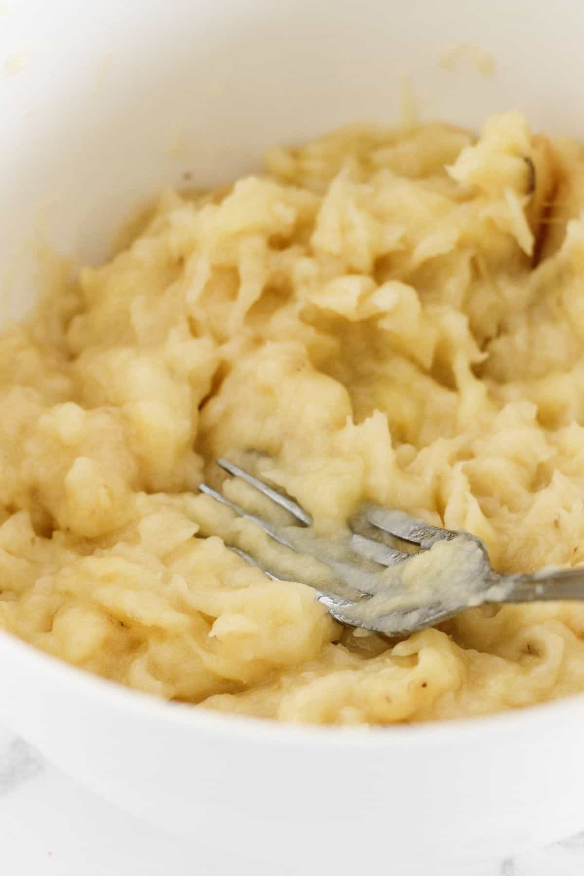 Mashed bananas in a bowl.