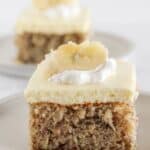 Two slices of banana sheet cake with a cake mix