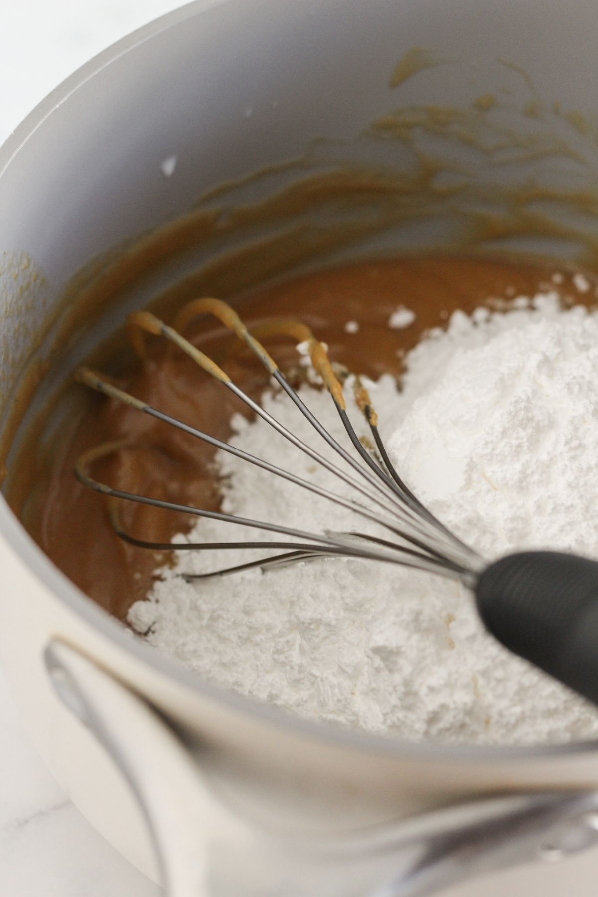 Making the peanut butter cooked frosting.