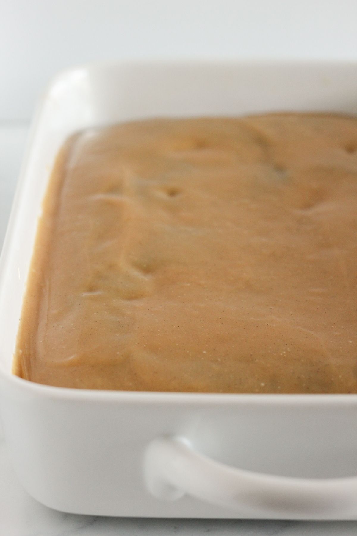 Chocolate cake covered in peanut butter frosting.