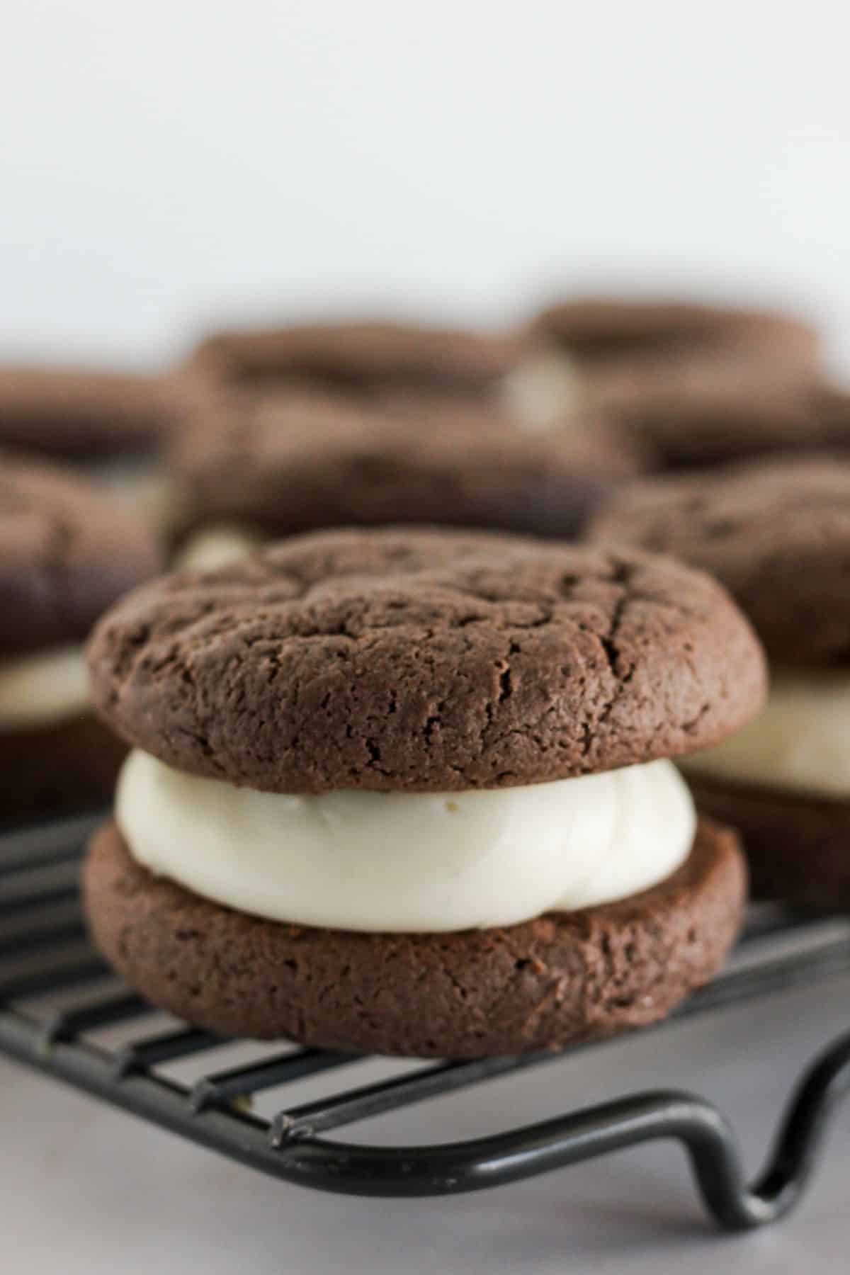 Adding the tops to sandwich cookies.