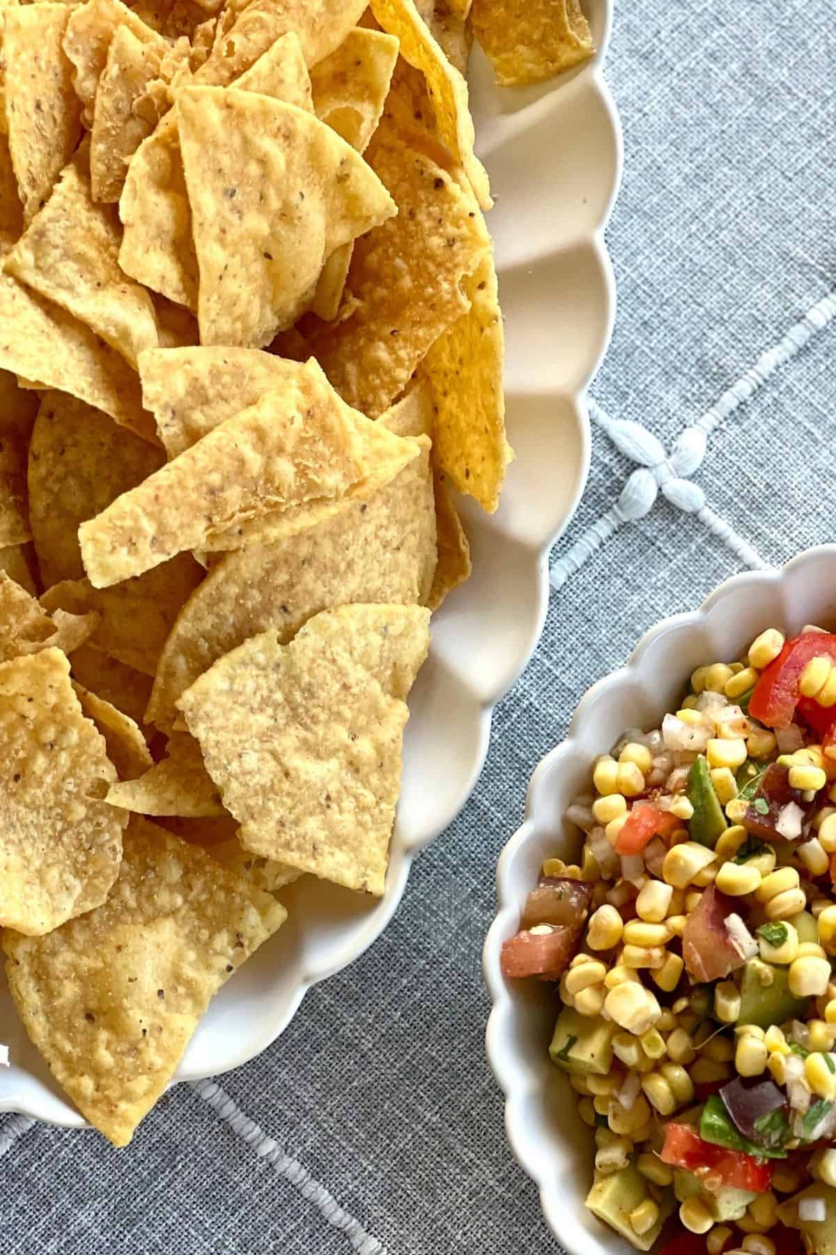 Chips and corn salsa on the table.