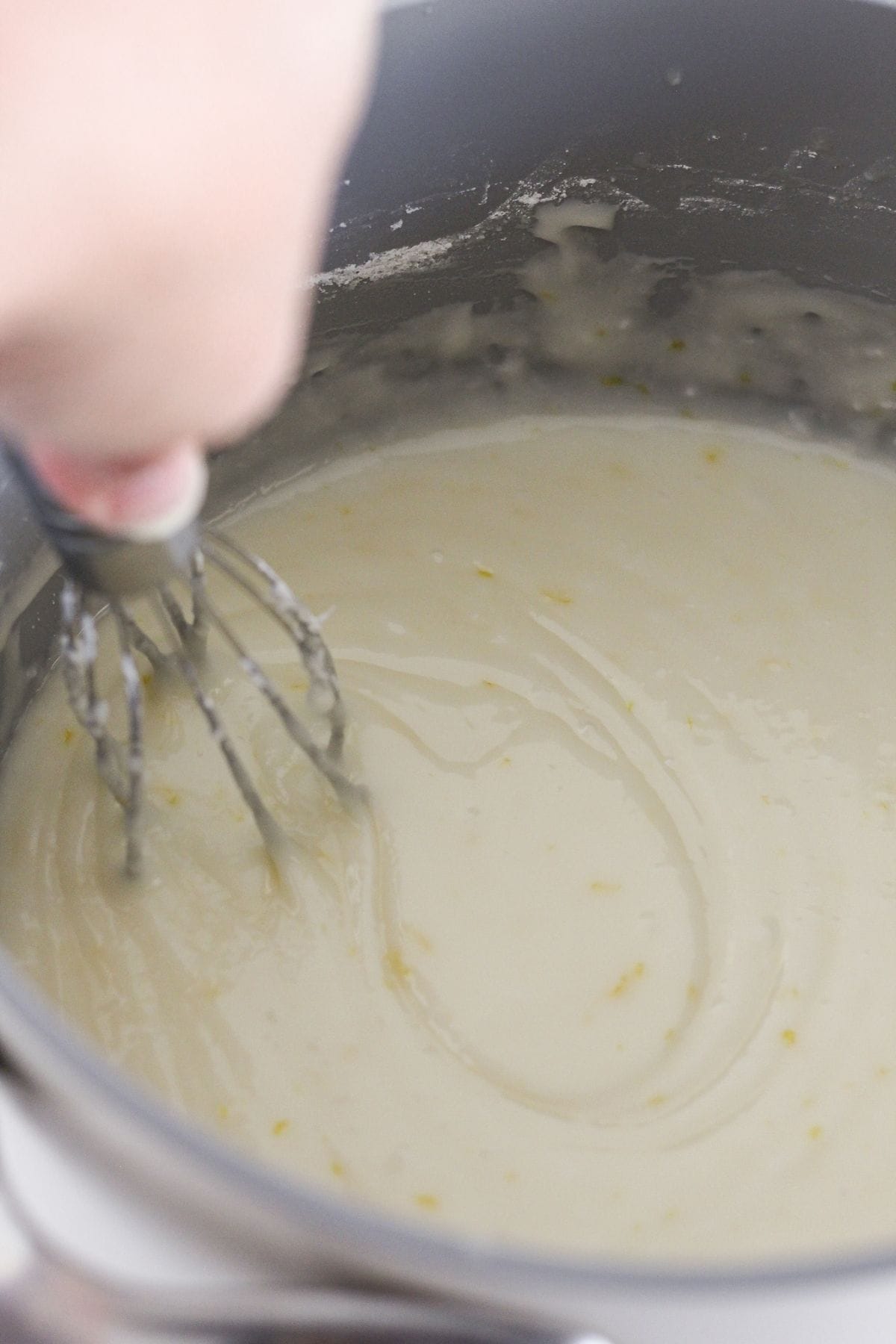 Making the cooked lemon glaze.