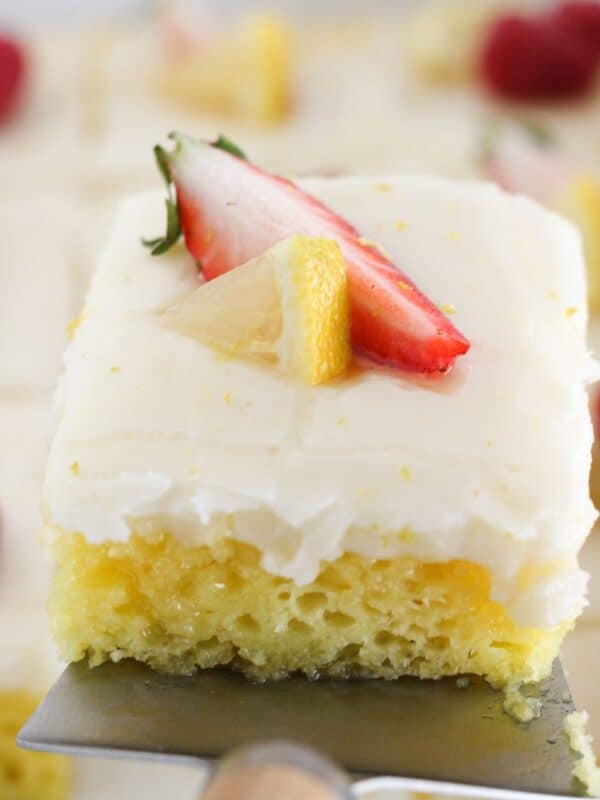 Removing a piece of lemon cake from pan.
