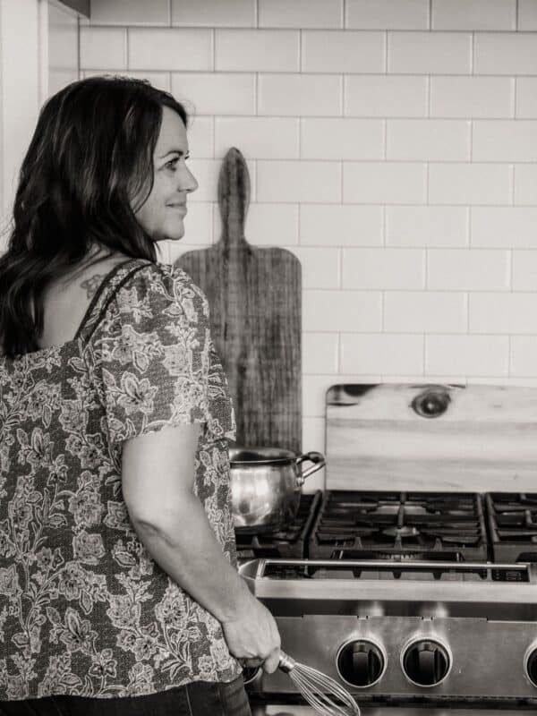 Making dinner at the stove.