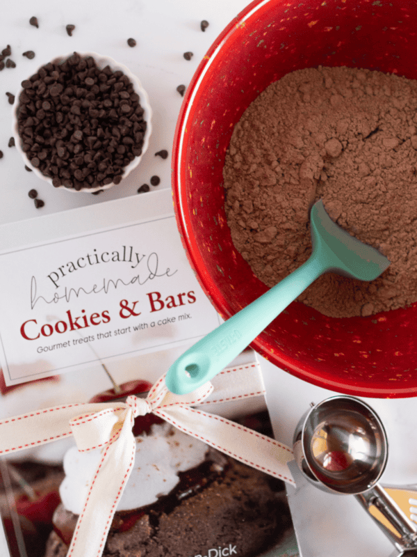 Making cookies with a cake mix from cookbook.