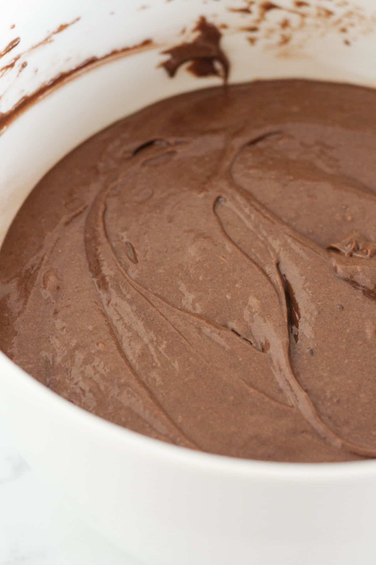 Chocolate cake batter in a bowl.
