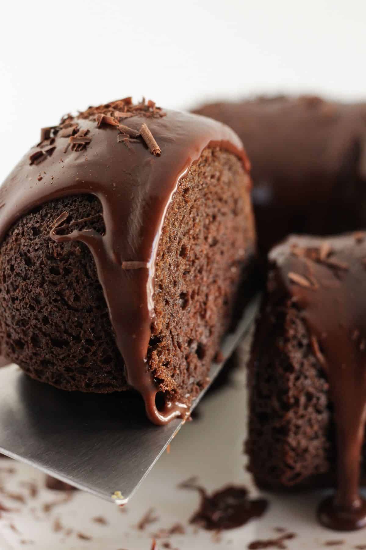 Serving a slice of chocolate bundt cake.