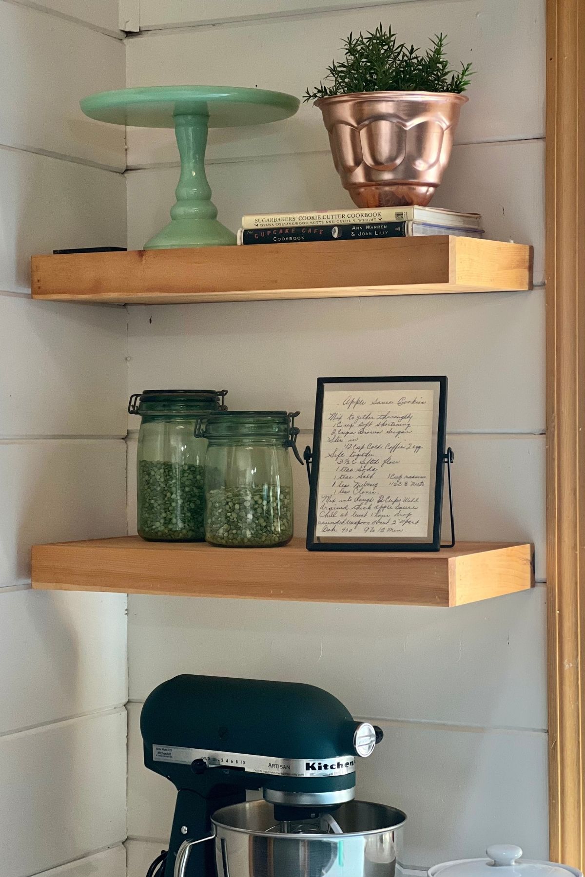 Shelving in my kitchen with a framed recipe from my grandma.